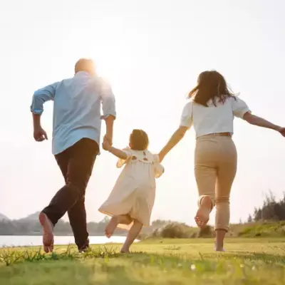 family-running-holding-hands